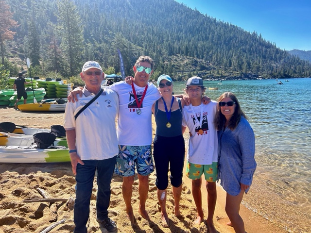 Susie Krause poses with her family, including her son and grandson who also earned medals in the most recent Lake Tahoe Sharkfest. (Photo courtesy Susie Krause)