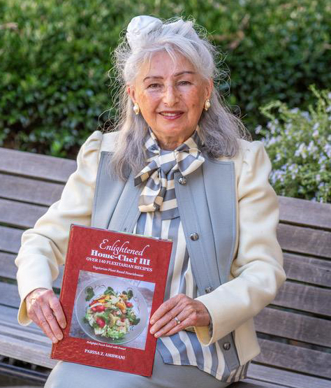 Danville author Parisa Z. Ambwani shows off her latest vegetarian cookbook, "Enlightened Home-Chef III". (Contributed photo)